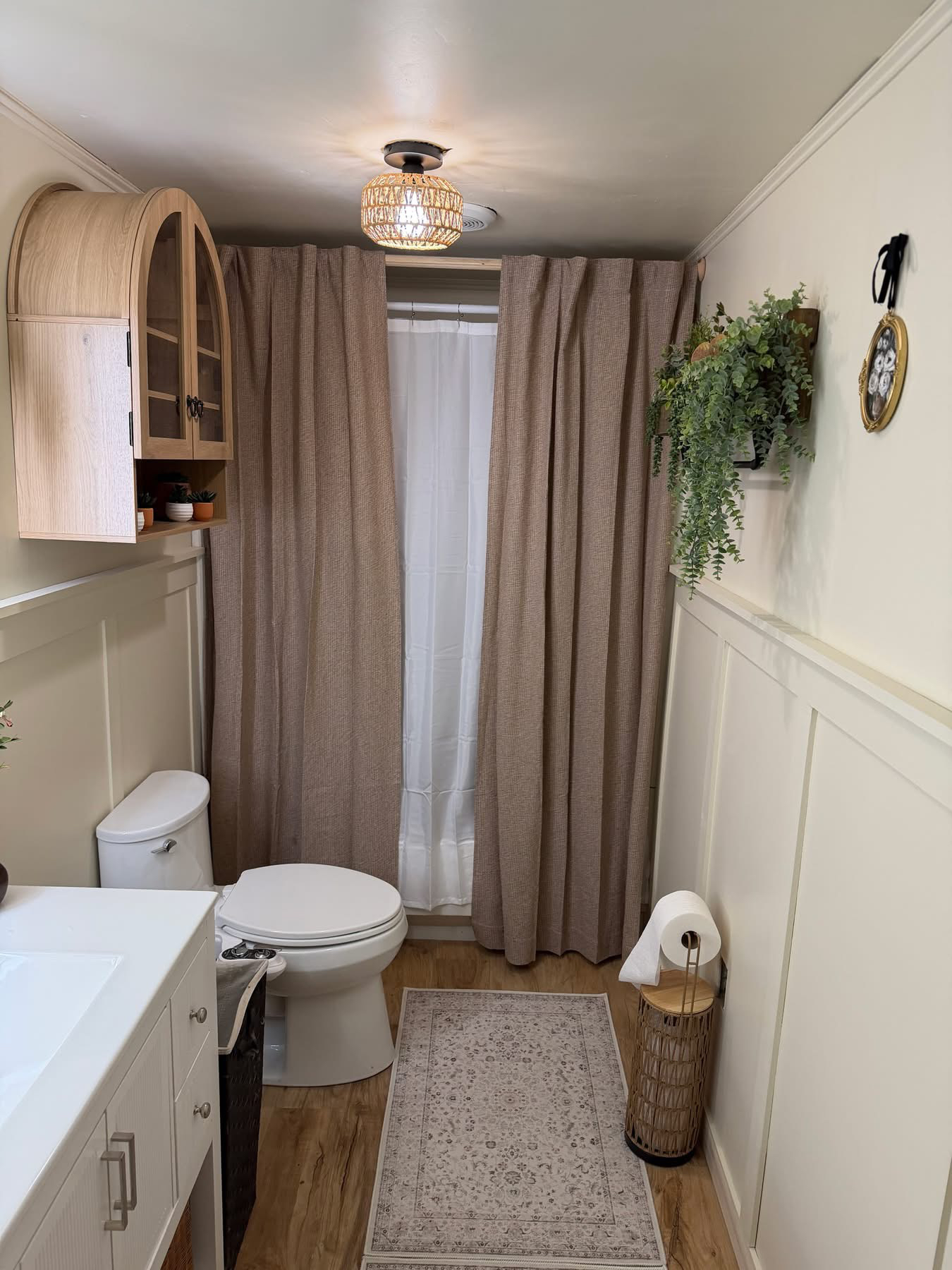 After — Wall niche transformed with arched cabinet and decorative styling